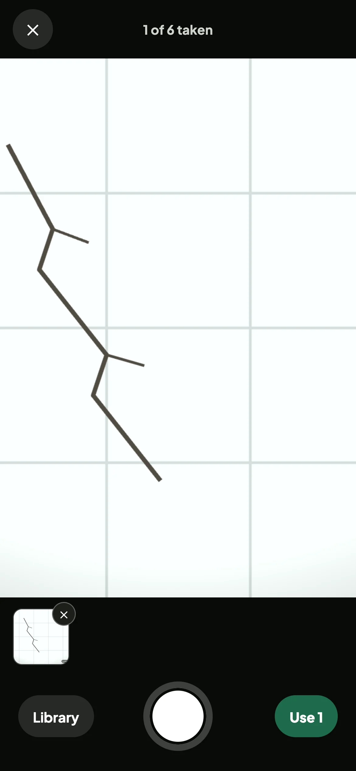 The in-app camera showing a cracked wall tile, with one shot taken and a Use 1 button